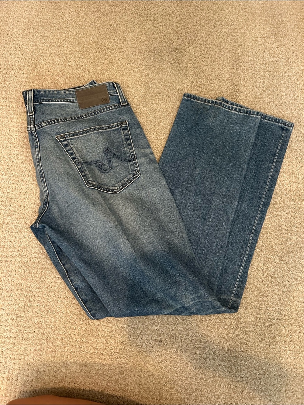 AG Adriano Goldschmied Men’s Blue Bootcut Jeans with Subtle Fade